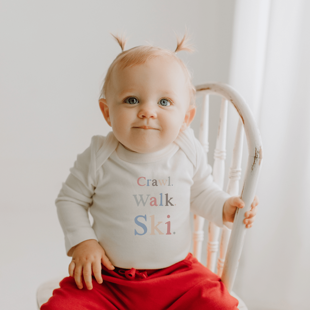 Baby long sleeve graphic bodysuit | crawl walk ski finn + emma